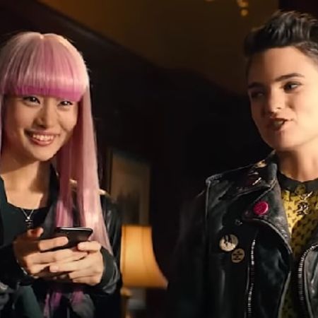 Yukio is on her phone smiling as Negasonic Teenage Warhead is right next to her.